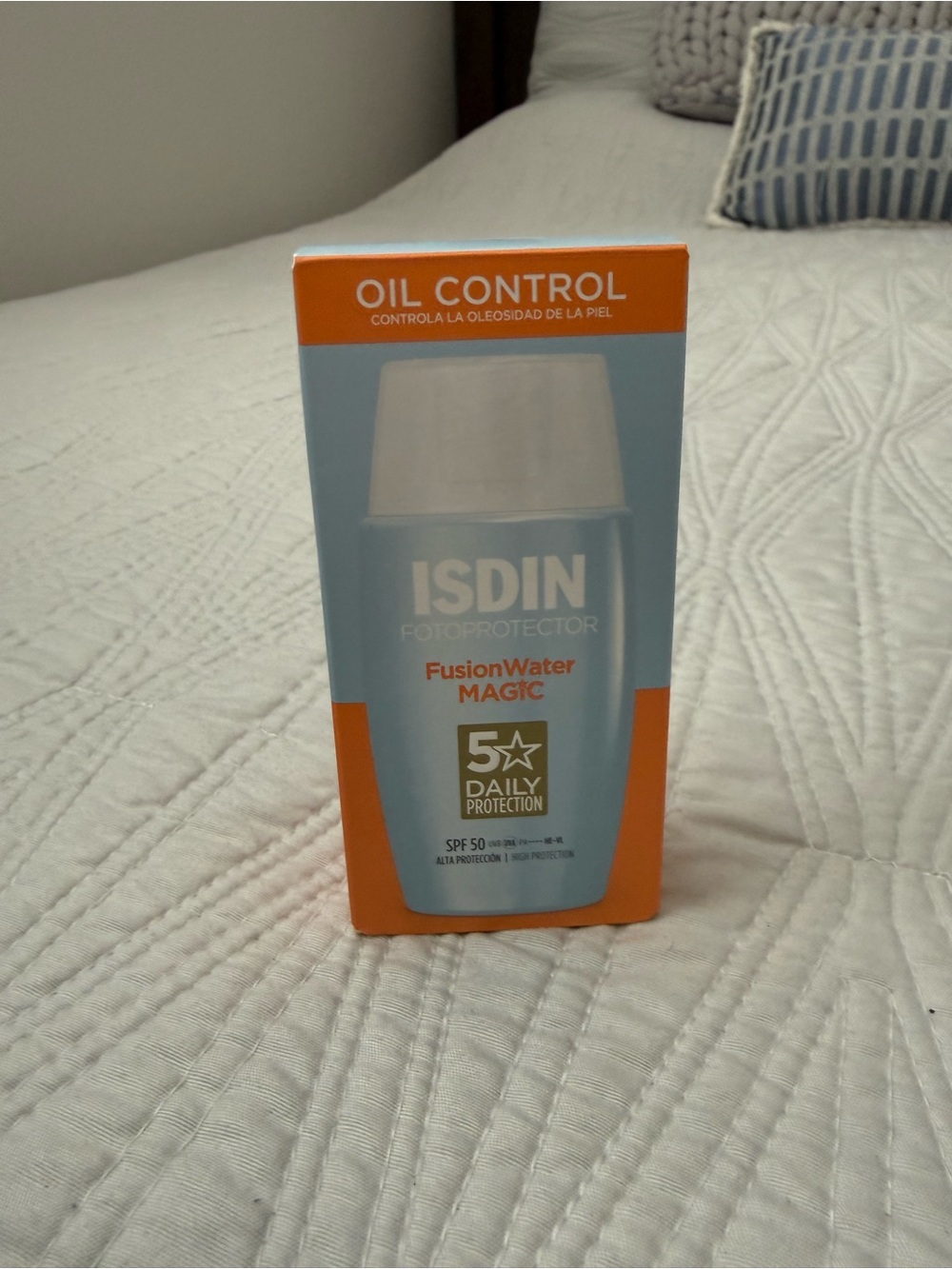 ISDIN Fusion Water Magic Oil Control SPF 50 Sunscreen - Orange/Blue
